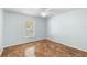 A basic, empty bedroom with a window and tile flooring at 454 Eagle Dr, Kissimmee, FL 34759