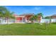 Charming single-Gathering home boasts vibrant curb appeal with lush landscaping and a well-maintained lawn at 454 Eagle Dr, Kissimmee, FL 34759
