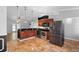 Kitchen with wooden cabinets, stainless steel appliances, and tiled floors at 454 Eagle Dr, Kissimmee, FL 34759