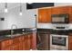 Kitchen with wooden cabinets and stainless appliances at 454 Eagle Dr, Kissimmee, FL 34759