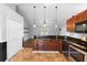 Kitchen with dark wood cabinets and stainless appliances at 454 Eagle Dr, Kissimmee, FL 34759