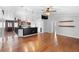 Spacious living room featuring hardwood floors and an open layout with a view of the kitchen at 454 Eagle Dr, Kissimmee, FL 34759
