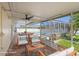 Enclosed patio area featuring comfortable seating and an outdoor dining area overlooking the pool at 454 Eagle Dr, Kissimmee, FL 34759
