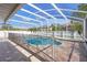 A beautiful screened-in pool with brick pavers and a safety fence is perfect for outdoor enjoyment at 454 Eagle Dr, Kissimmee, FL 34759
