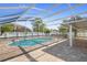 The private screened-in pool area includes brick pavers and a safety fence for added security at 454 Eagle Dr, Kissimmee, FL 34759