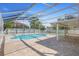 An inviting screened-in pool and a covered patio offer a relaxing outdoor living space at 454 Eagle Dr, Kissimmee, FL 34759