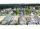 Aerial view of a well-kept neighborhood with beautiful homes and private screened in pools in back at 4707 Pershoie Ln, Kissimmee, FL 34746