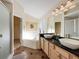 Bathroom with double sinks, walk-in shower and large tub, plenty of natural light at 4707 Pershoie Ln, Kissimmee, FL 34746