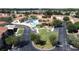 Aerial view of community green and courtyard with lush landscaping at 4707 Pershoie Ln, Kissimmee, FL 34746