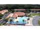 A fantastic aerial view of the community pool, deck and lounge area at 4707 Pershoie Ln, Kissimmee, FL 34746