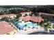 Aerial view of community pool and cabana with lounge chairs at 4707 Pershoie Ln, Kissimmee, FL 34746