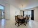 Well-lit dining room with a large table, comfortable seating, and natural light at 4707 Pershoie Ln, Kissimmee, FL 34746
