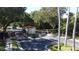 Community entrance gatehouse with palm trees and manicured lawns on a bright, sunny day at 4707 Pershoie Ln, Kissimmee, FL 34746