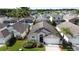 A one-story home with a blue front door, beautiful lawn, and a driveway leading to a garage at 4707 Pershoie Ln, Kissimmee, FL 34746