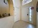 Bright foyer features tile flooring, neutral walls, and a decorative niche at 4707 Pershoie Ln, Kissimmee, FL 34746