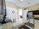 View of a kitchen with stainless steel appliances and granite countertops at 4707 Pershoie Ln, Kissimmee, FL 34746