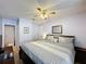 Spacious main bedroom featuring a ceiling fan, carpet flooring, and ensuite bathroom entrance at 4707 Pershoie Ln, Kissimmee, FL 34746