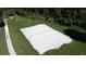 Aerial view of community sand volleyball court with lake in the background at 4707 Pershoie Ln, Kissimmee, FL 34746