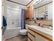 Bathroom with a shower and tub combo, a toilet, a vanity with a sink and a mirror at 4824 Reginald Rd, Orlando, FL 32829