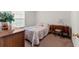 Bedroom features carpet flooring, light colored walls, and a single casement window at 4824 Reginald Rd, Orlando, FL 32829