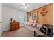 Bedroom with a twin-size bed, carpeted floors, a window, wood paneling, and a ceiling fan at 4824 Reginald Rd, Orlando, FL 32829
