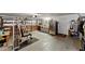 Spacious garage featuring a home gym setup and ample storage, plus a stainless steel refrigerator at 4824 Reginald Rd, Orlando, FL 32829