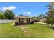A cozy single-story home with a well-manicured lawn and garden beds featuring decorative accents at 4824 Reginald Rd, Orlando, FL 32829