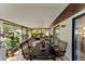 Enclosed patio with tile flooring, a table with chairs, and plants at 4824 Reginald Rd, Orlando, FL 32829