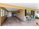 Large carport area with ample parking and access to the home's entrance, enhanced with outdoor seating at 512 Maryland Ave, St Cloud, FL 34769
