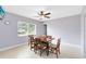 Cozy dining room with a ceiling fan and large window, offers a comfortable space for Gathering meals at 512 Maryland Ave, St Cloud, FL 34769