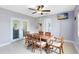 Well-lit dining room with a wooden table and chairs, perfect for enjoying meals with a view of the outdoors at 512 Maryland Ave, St Cloud, FL 34769