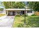 Charming single-story home with a well-maintained lawn and covered front porch at 512 Maryland Ave, St Cloud, FL 34769