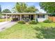 Charming single-story home with a well-maintained lawn and covered front porch, offers inviting curb appeal at 512 Maryland Ave, St Cloud, FL 34769