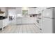 Bright kitchen featuring white cabinets, tiled floor, and a layout perfect for cooking and entertaining at 512 Maryland Ave, St Cloud, FL 34769