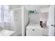 Functional laundry area includes a shower and washing machine, offering convenience at 512 Maryland Ave, St Cloud, FL 34769