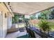 Inviting screened porch with outdoor seating, perfect for enjoying the fresh air and backyard view at 512 Maryland Ave, St Cloud, FL 34769