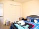 Cozy bedroom features a closet and soft, comfortable decor, creating a relaxing space at 5506 Glen Lake Ln, Orlando, FL 32808