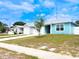 Eye-catching single-story home with a one-car garage, light blue siding, and a concrete driveway at 5506 Glen Lake Ln, Orlando, FL 32808