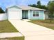 Charming single-story home with a one-car garage and a well-manicured front yard at 5506 Glen Lake Ln, Orlando, FL 32808