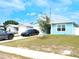 Beautiful light blue single-story home with a one-car garage and a long concrete driveway at 5506 Glen Lake Ln, Orlando, FL 32808