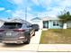 Attractive single-story home featuring a one-car garage, light blue siding, and a well-kept lawn at 5506 Glen Lake Ln, Orlando, FL 32808