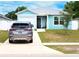 Charming single Gathering home with a one car garage, well kept lawn, and modern exterior paint at 5506 Glen Lake Ln, Orlando, FL 32808