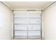 The garage door is a paneled door with metal framing and mechanisms at 5506 Glen Lake Ln, Orlando, FL 32808