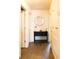 Hallway features a decorative table, mirror, and lighting, creating a welcoming and stylish entrance at 5506 Glen Lake Ln, Orlando, FL 32808