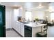 Stylish kitchen with white cabinetry, stainless steel sink, and a spacious layout for entertaining guests at 5506 Glen Lake Ln, Orlando, FL 32808