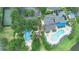 Aerial view of the community pool and facilities featuring a water playground, large pools and pickleball courts at 607 Gran Bahama Blvd # B29/U607, Davenport, FL 33897