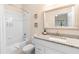 Bright bathroom featuring a shower-tub combo with white tiled walls and a granite vanity countertop at 607 Gran Bahama Blvd # B29/U607, Davenport, FL 33897