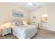 Inviting bedroom features soft lighting, neutral tones, and an ensuite bathroom for added convenience at 607 Gran Bahama Blvd # B29/U607, Davenport, FL 33897