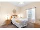 Cozy bedroom with a queen bed, ceiling fan, and wicker nightstands, illuminated by bedside lamps at 607 Gran Bahama Blvd # B29/U607, Davenport, FL 33897