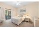Cozy bedroom with a queen-size bed, soft lighting, and sliding doors leading to a private balcony at 607 Gran Bahama Blvd # B29/U607, Davenport, FL 33897